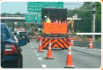 A truck-mounted attenuator in the buffer area of a closed lane in a work zone.